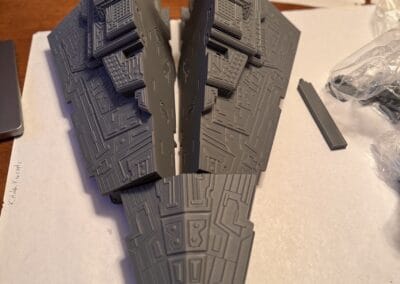 Detailed gray Millennium Falcon model kit from Star Wars for collectors.